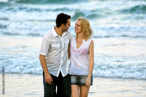 couple strolling along the beach