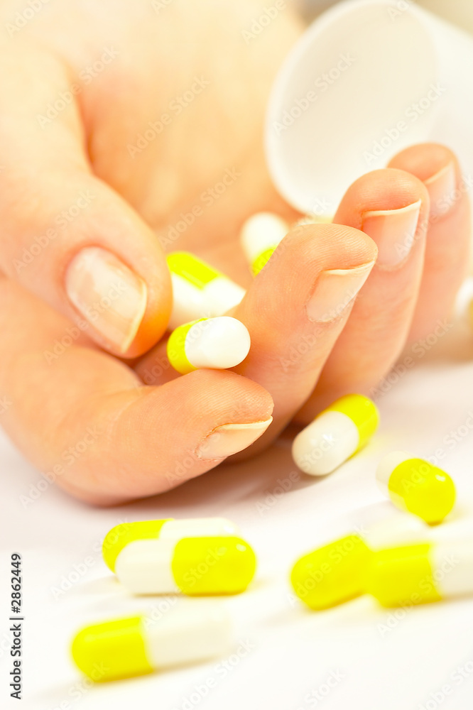 female hand with tablets. female hand with tablets.