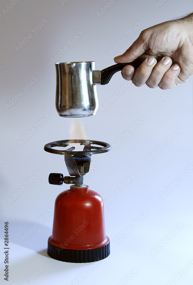 a hand hold a coffee-pot a hand hold a coffee-pot