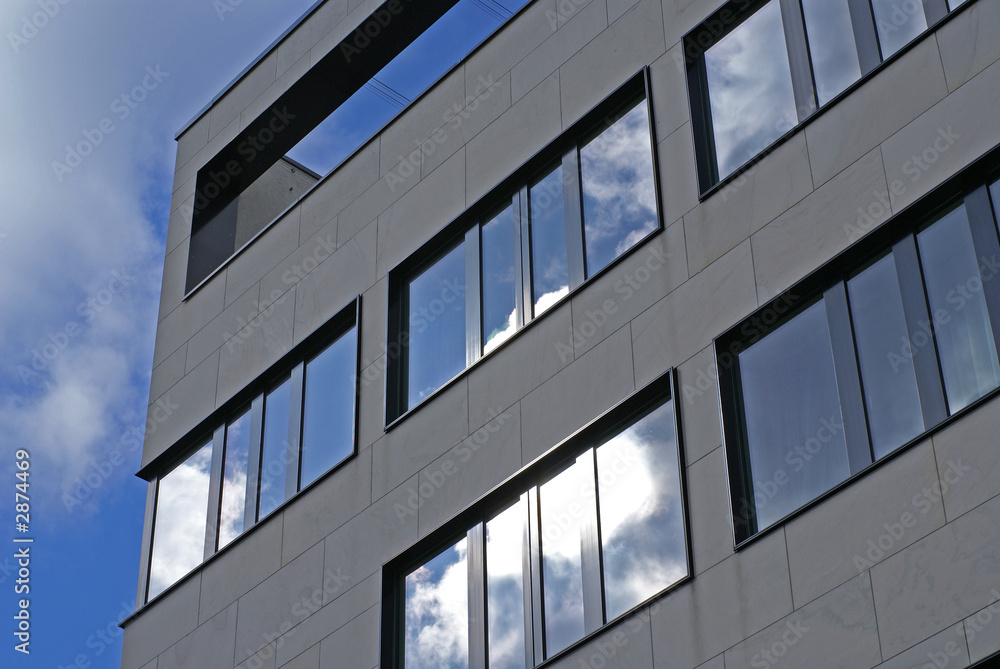 modern facade and ominous sky