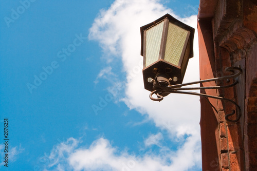 Fotografie old street lantern on a background of the blue sky
