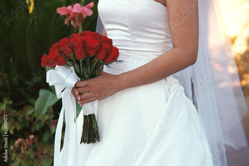 bride with red rose bouquet