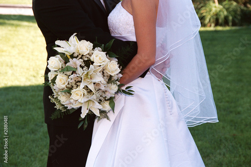 bridal couple with cream rose bouquet