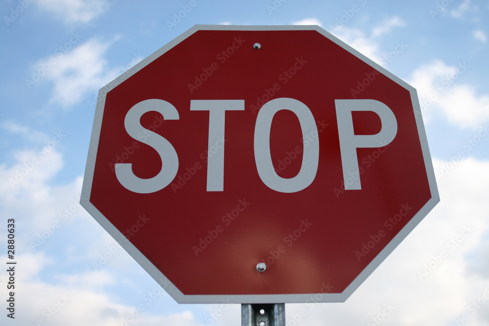 stop sign against an evening sky