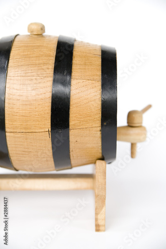 a small barrel with beer inside photo