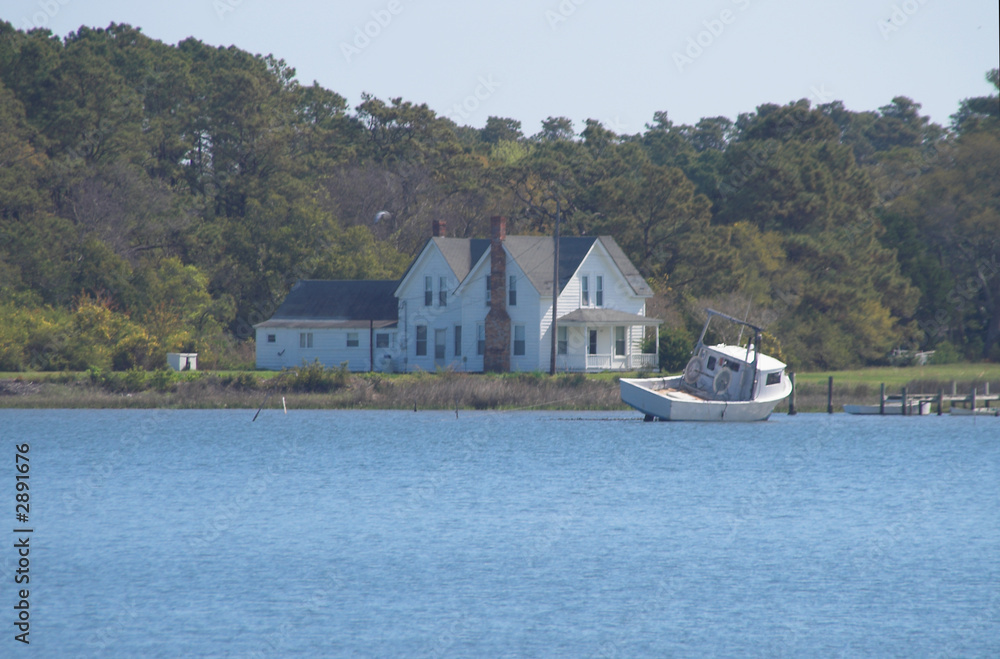 Fototapeta premium seaside house and shrimp boat