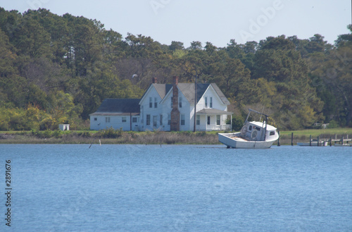 seaside house and shrimp boat