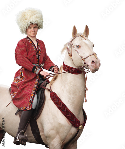 rider and akhal-teke horse - isolated on white photo