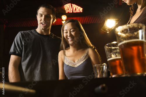 young couple at foosball table.