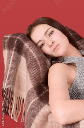 young woman sitting on armchair