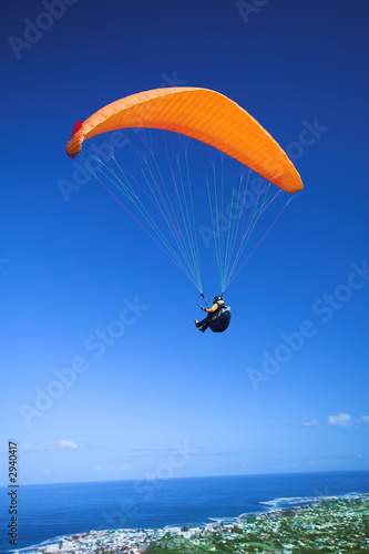 paraglider launching from the mountain ridge