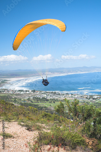 paraglider ridge soaring next to the mountain