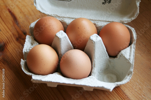 box of eggs with one missing