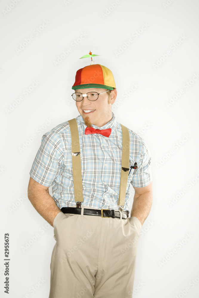 young man dressed like nerd with hands in pockets. young man dressed like nerd with hands in pockets.