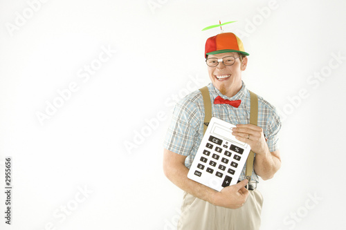 young man dressed like nerd holding large calculator. photo