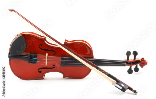 violin with bow lying side down on white backgroun