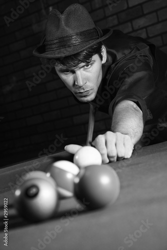 retro male shooting pool.
