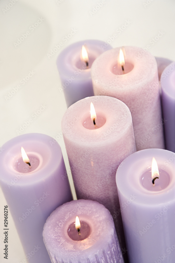 Close up of lit lavendar candles. Close up of lit lavendar candles.