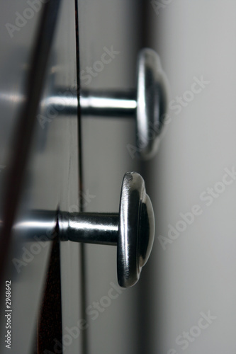 silver knobs on black background