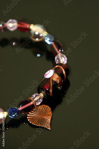 pink beaded braclet with copper heart