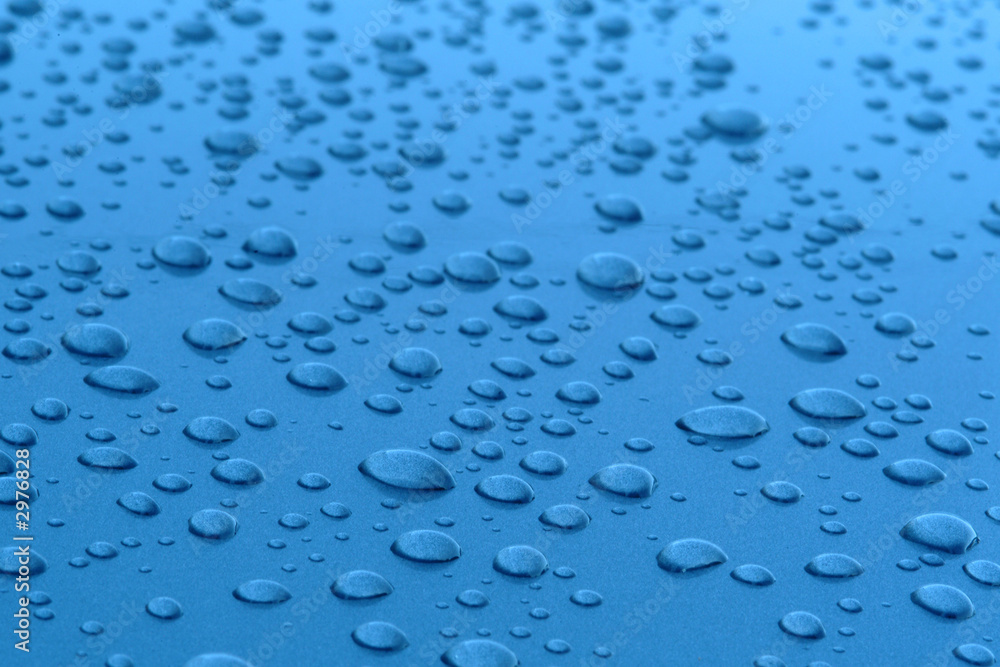 water drops in blue metalized surface