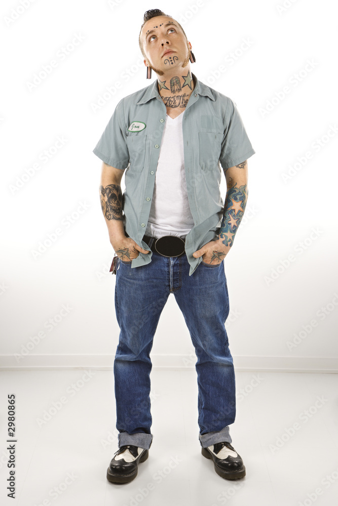 Adult male with tattoos and piercings. Adult male with tattoos and piercings.