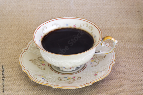 antique cup with hot coffee