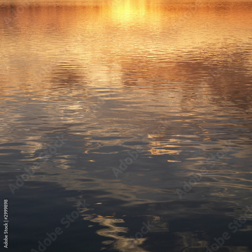 reflections of sunset on water.