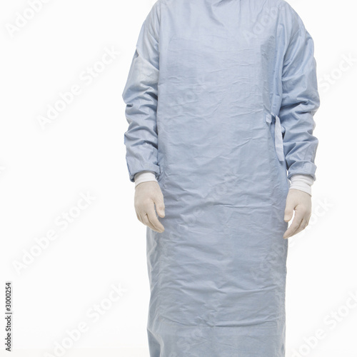 male wearing scrubs and medical latex gloves.