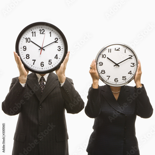 Obraz na plátne businesspeople holding clocks.