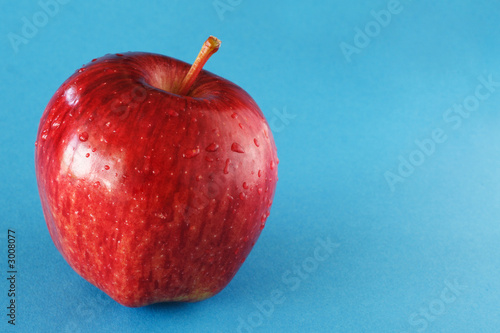 red apple on blue