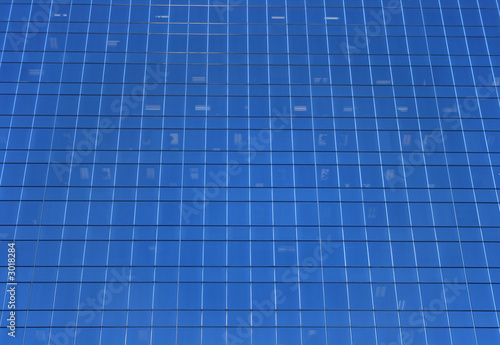 glass-windowed wall of skyscraper