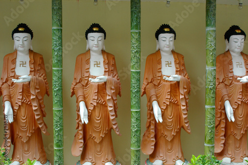 four buddha statues photo