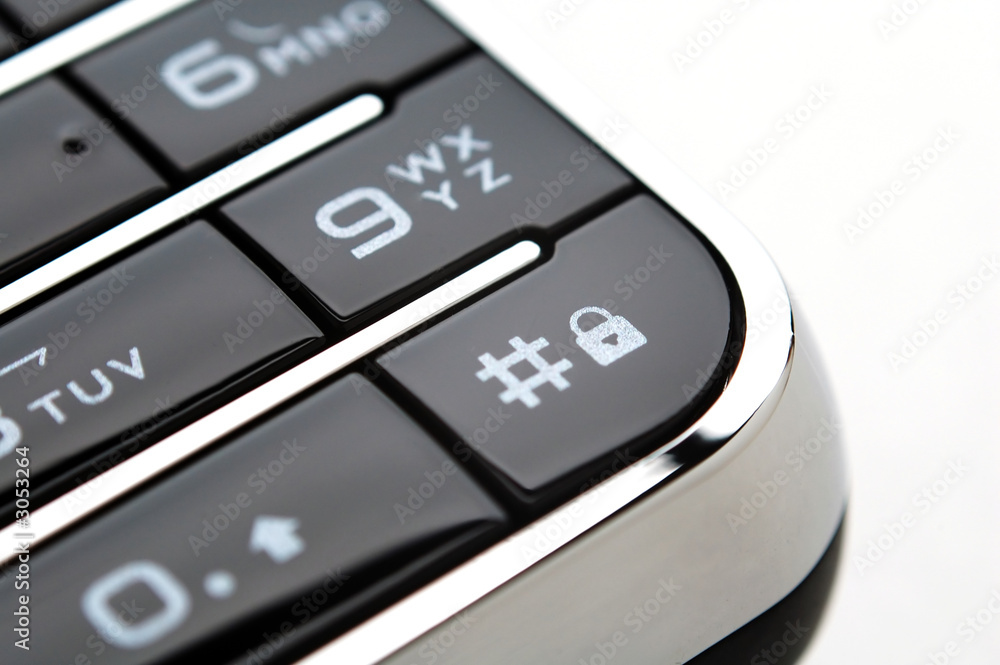 close up shot of mobile keypad under light