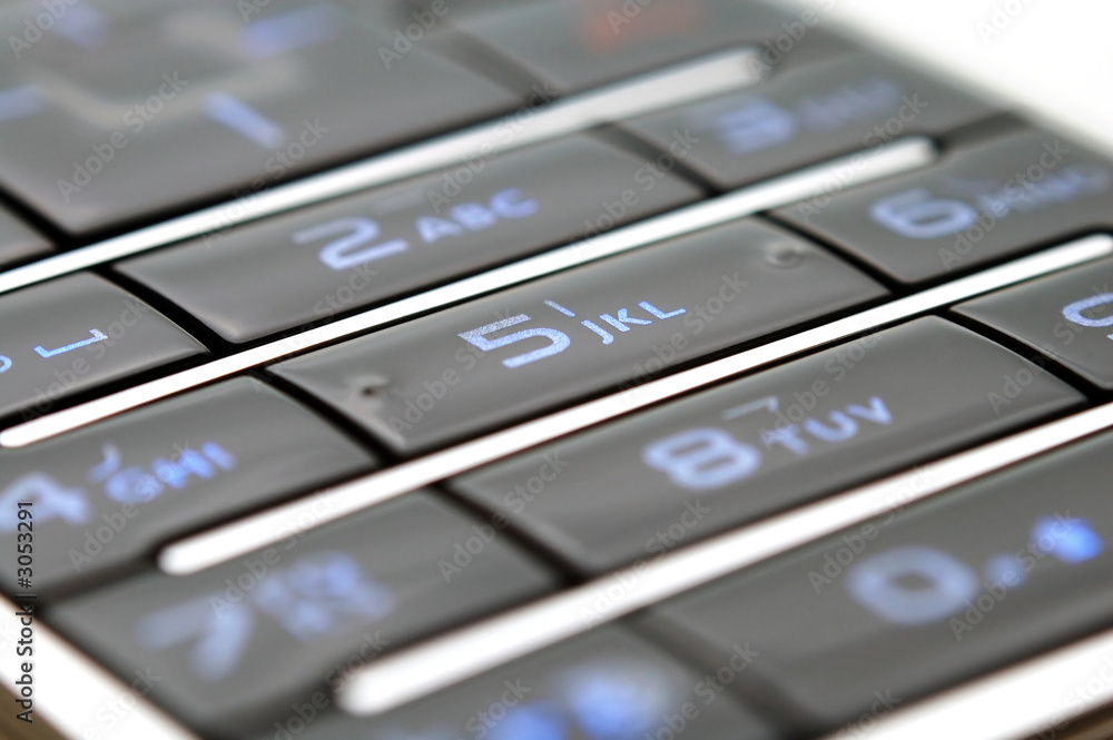 close up shot of mobile keypad under light close up shot of mobile keypad under light