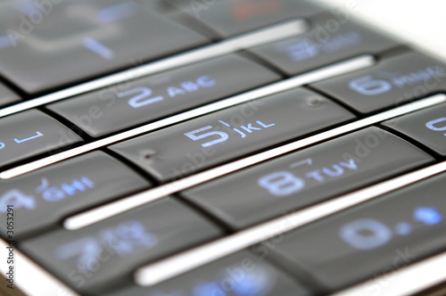 close up shot of mobile keypad under light