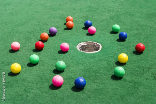 scattered golf balls photo