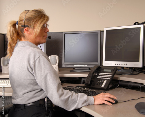 police dispatcher working at console
