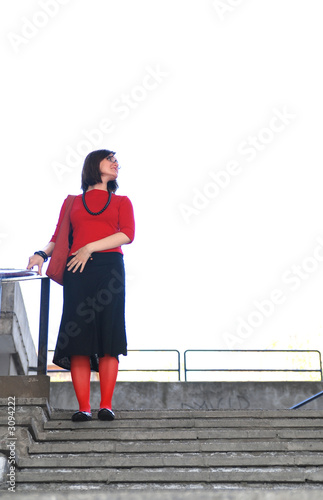 woman in red on stairs