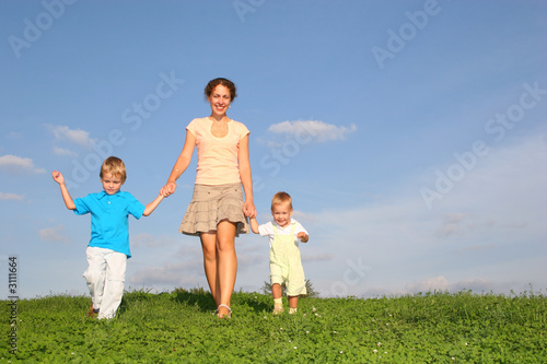 mother with children on meadow
