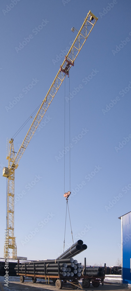 the crane loads pipes the crane loads pipes