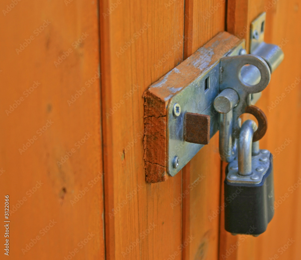 padlock and shootbolt on a garden shed padlock and shootbolt on a garden shed