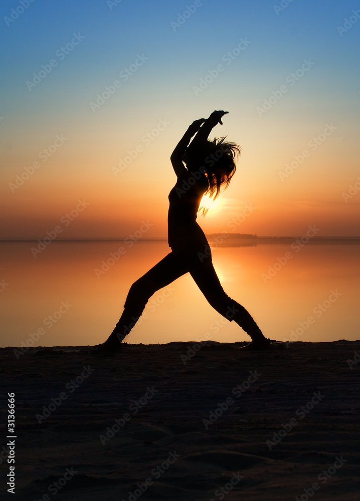 the girl is practising yoga.