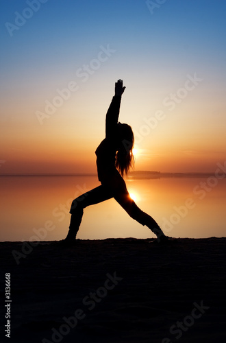 the girl is practising yoga.