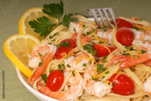 bowl of lemon pasta with shrimp and tomatoes