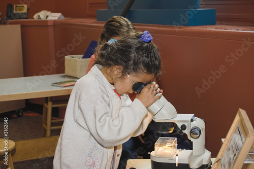 child with microscope