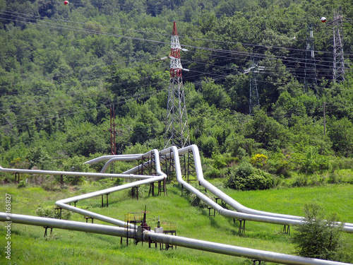 pipeline in green landscape photo