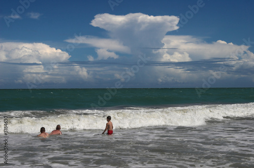 storm brewing over bathers © Wollwerth Imagery
