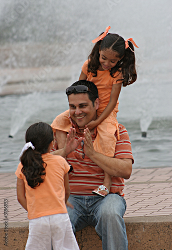 father and twin daughters