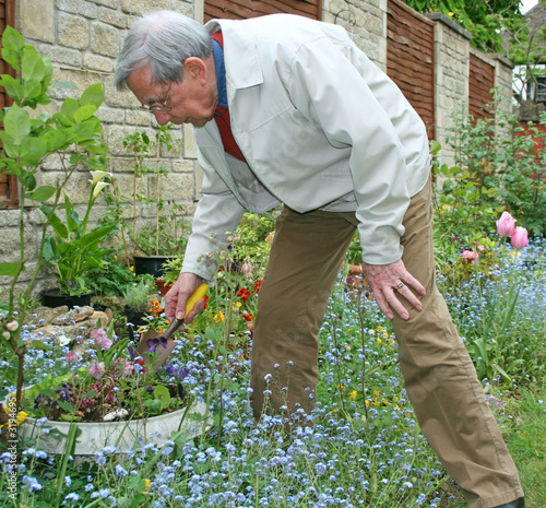retired gentleman digging the garden